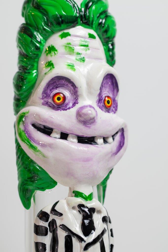 14-inch Killing Clown Bong – a water pipe with a twisted design for weed and dabs in water breaker style glass. For sale now, this unique piece features a Killing Clown design shape, a 14MM male bowl piece for weed, and a straight down stem, 