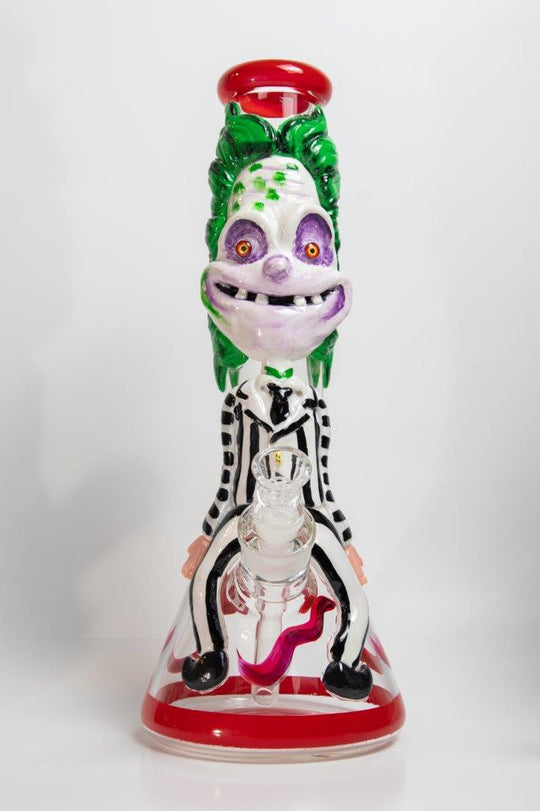 14-inch Killing Clown Bong – a water pipe with a twisted design for weed and dabs in water breaker style glass. For sale now, this unique piece features a Killing Clown design shape, a 14MM male bowl piece for weed, and a straight down stem, 