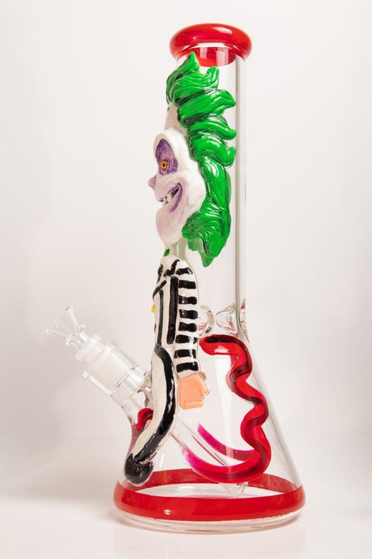 14-inch Killing Clown Bong – a water pipe with a twisted design for weed and dabs in water breaker style glass. For sale now, this unique piece features a Killing Clown design shape, a 14MM male bowl piece for weed, and a straight down stem, 