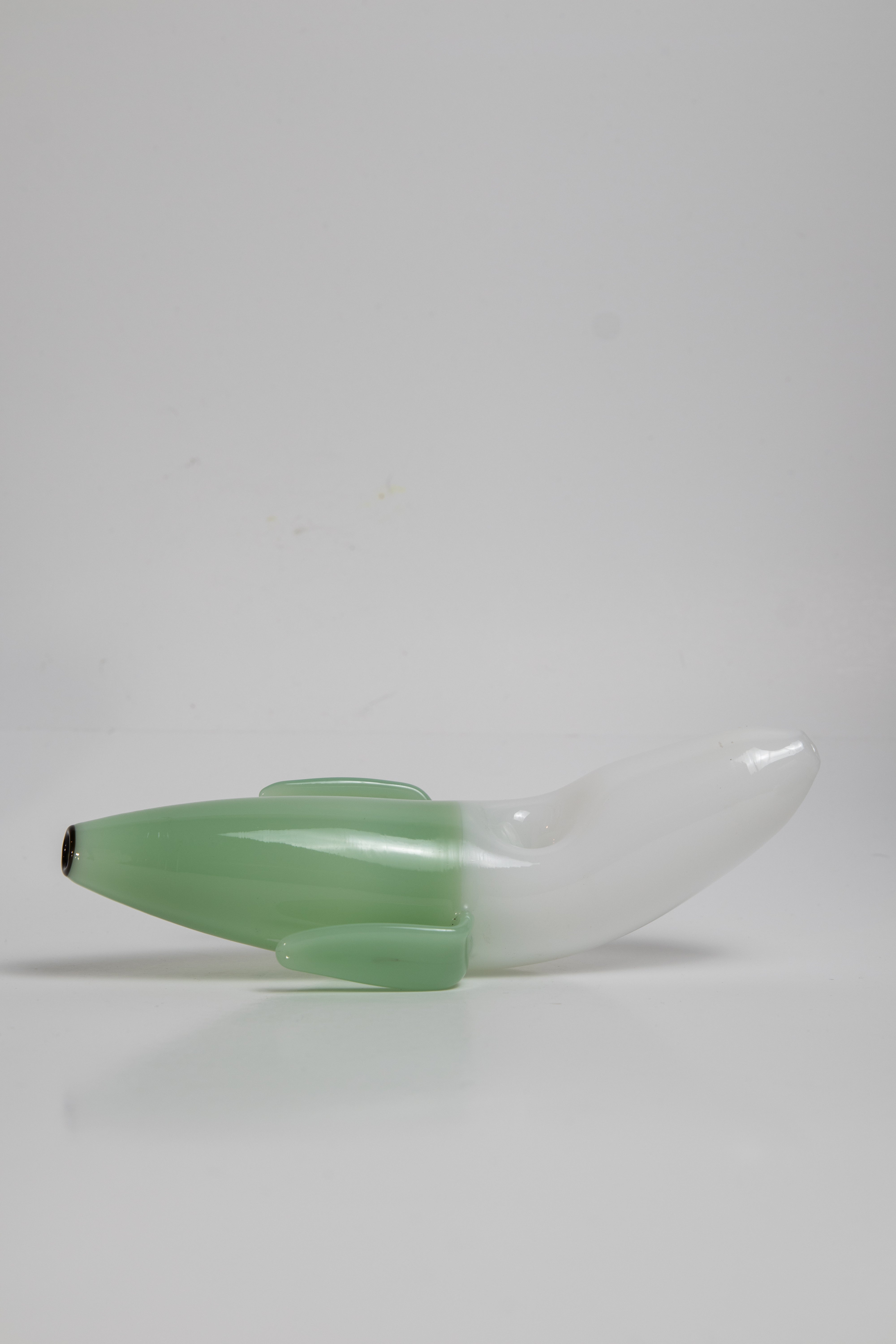 Ripe color shade  3.75 inch Banana Shape Glass Pipe, perfect for dry herb/weed use. This affordable and unique piece adds a touch of whimsy to your smoking collection.