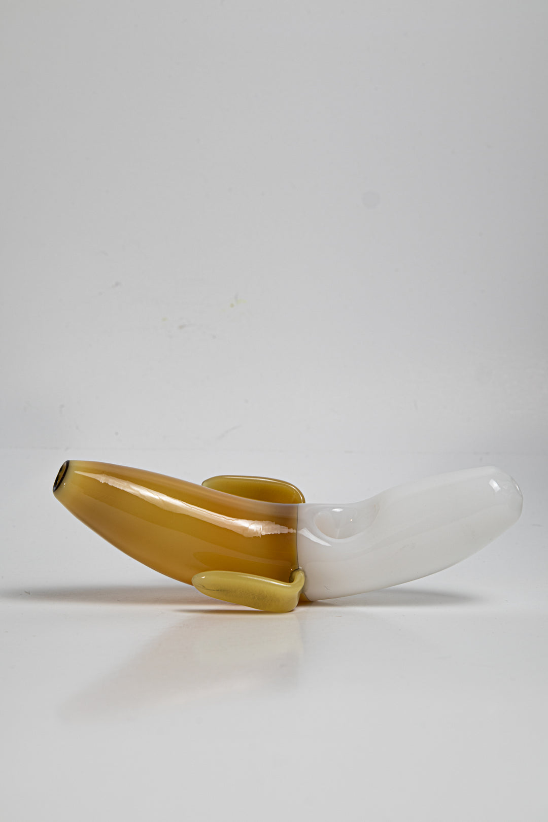 Yellow shade 3.75 inch Banana Shape Glass Pipe, perfect for dry herb/weed use. This affordable and unique piece adds a touch of whimsy to your smoking collection.