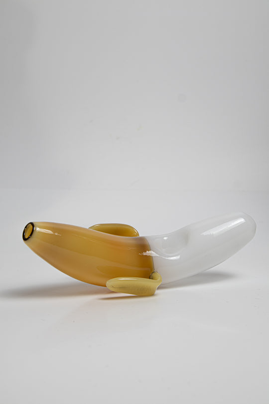 Yellow shade  3.75 inch Banana Shape Glass Pipe, perfect for dry herb/weed use. This affordable and unique piece adds a touch of whimsy to your smoking collection.