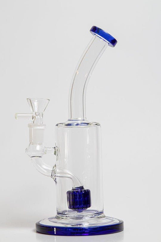 9-inch Water Rig Perc – a water pipe designed for weed and dabs. Now available for sale, this distinctive piece features a water rig shape, a 14MM male bowl piece for weed, and a tree perc bent down stem. The built-in percolator prevents water splashback, cools the smoke down, and offers extra filtration, providing a unique and refreshing twist to your smoke sessions