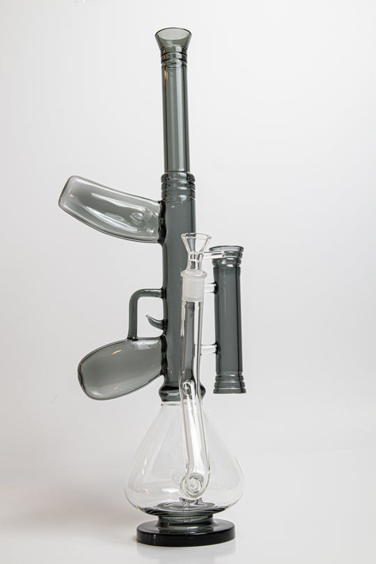 18.5-inch AK-47 Water Bong – a dynamic Beaker Bong designed for weed and dabs. Now available for sale, this unique piece includes a 14MM male bowl piece for weed, a bent down stem