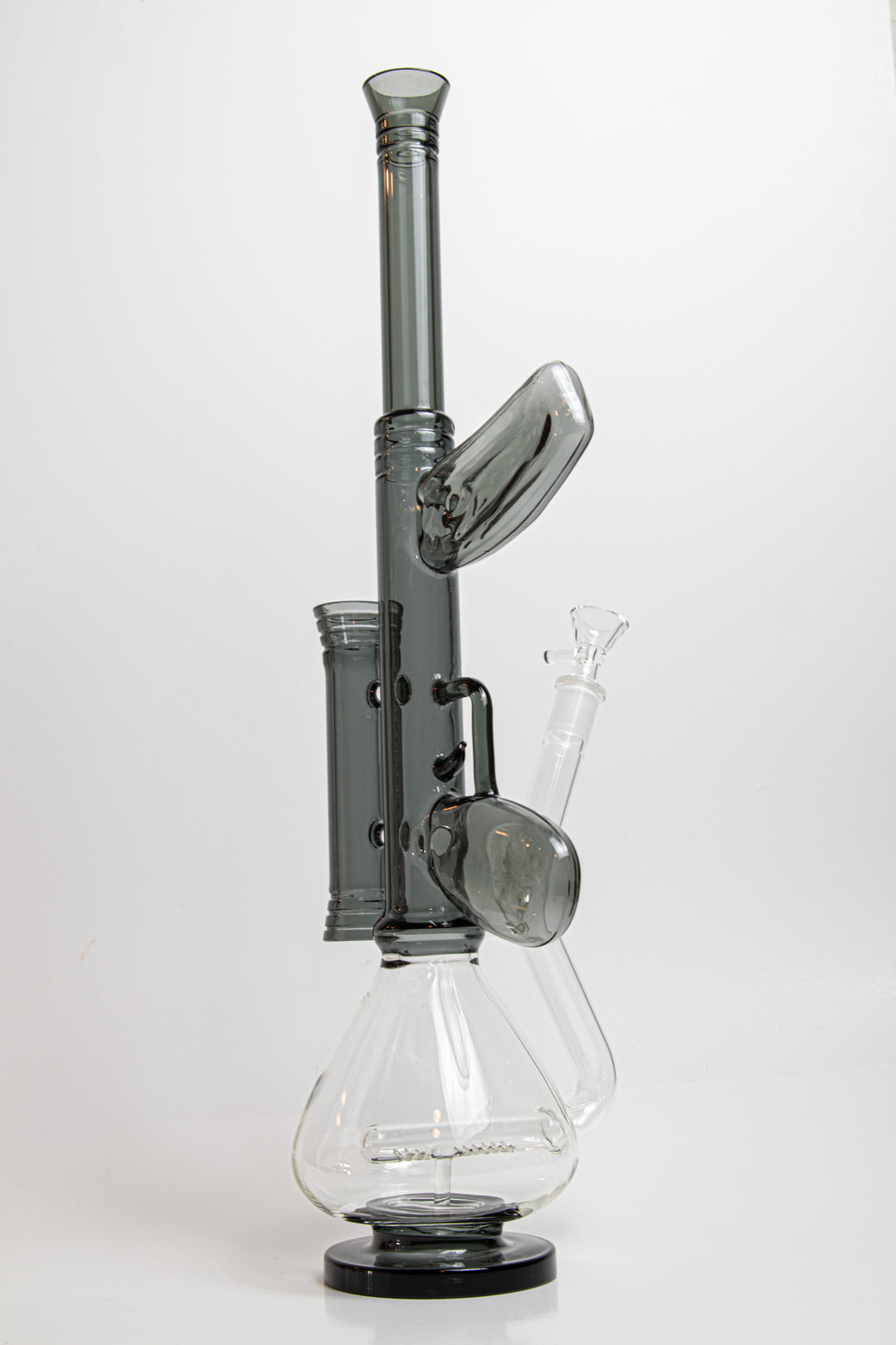 18.5-inch AK-47 Water Bong – a dynamic Beaker Bong designed for weed and dabs. Now available for sale, this unique piece includes a 14MM male bowl piece for weed, a bent down stem