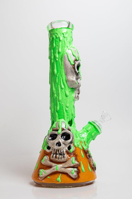 11-inch Toxic Death Beaker Bong – a captivating piece designed for weed and dabs. For sale now,  showcases a Toxic Death design, a 14MM male bowl piece for weed, and a straight down stem