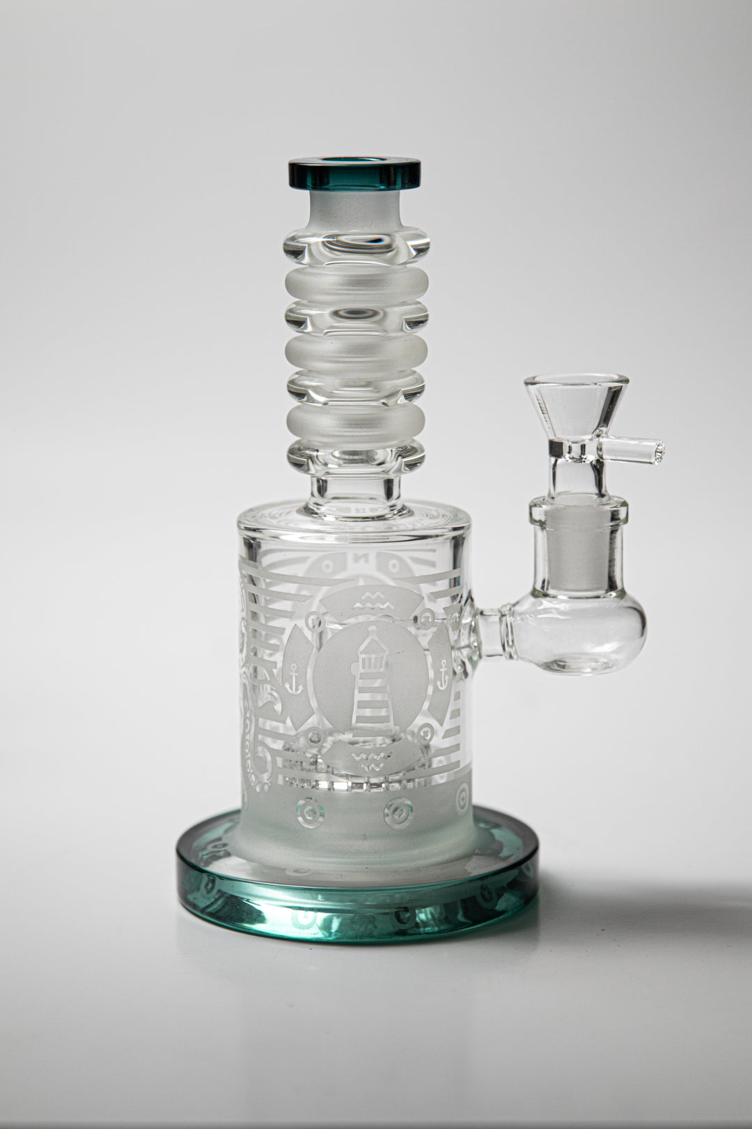 Unique 8.5-inch Sanded Water Pipe NECK MATRIX PERC RIG,equipped with a male 14mm weed bowl . It’s come with A clear base sand blast design an a teal bottom , teal mouth opening 