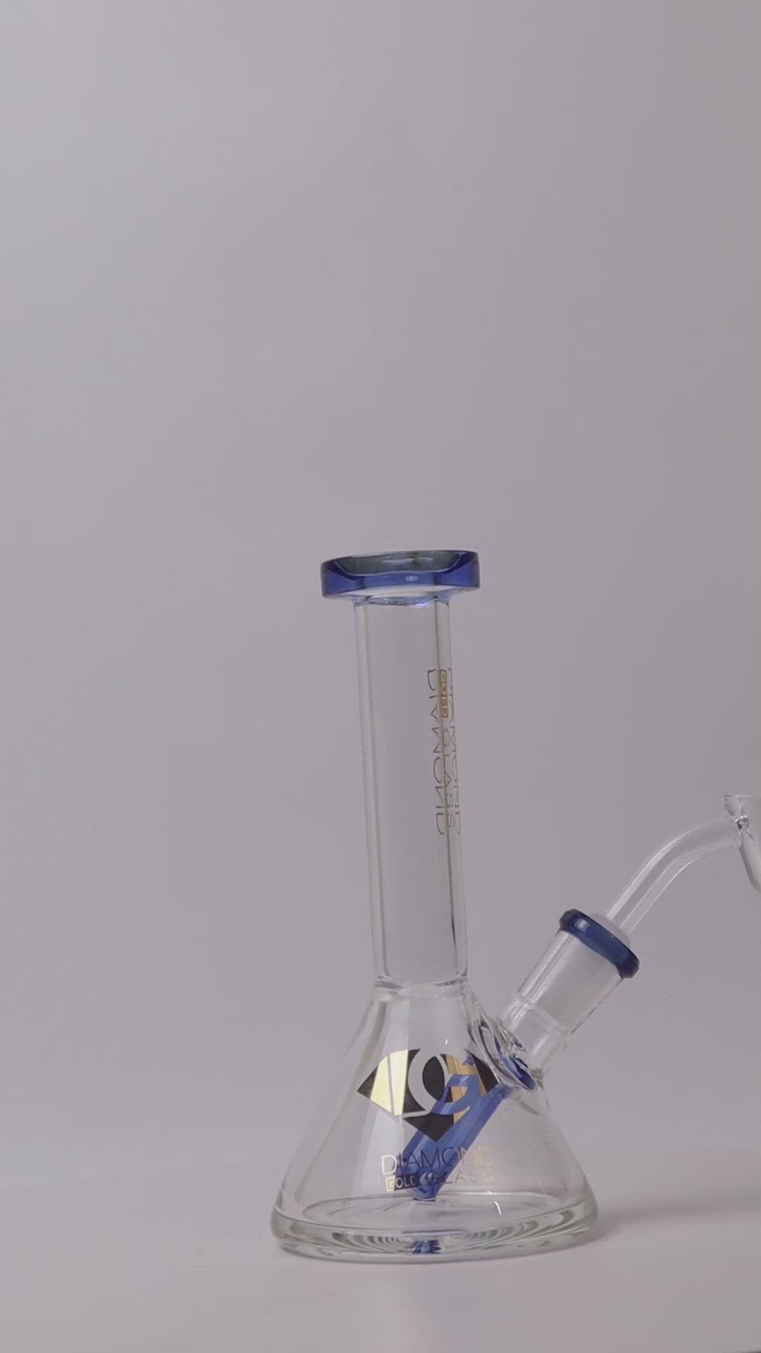 Diamond brand 6 -inch Beaker Rig – a luxurious choice for weed and dabs in water bong style glass. For sale now, this unique piece features a 14MM male banger/nail and a straight down stem, showcasing a classic beaker shape look 