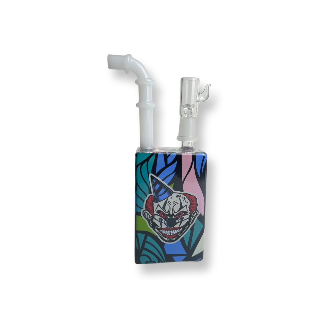 7.75 inch Party Clown Juice Box – a stoner's delight now on sale. Shaped like a juice box with a detachable straw and a unique female standard 14mm, this water rig adds a playful twist to your sessions. Elevate your smoking experience with this affordable and one-of-a-kind accessory